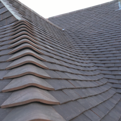 Shortlisted for the 2019's best tiled roof, here we have our laced valley work at 'The Vicarage'.